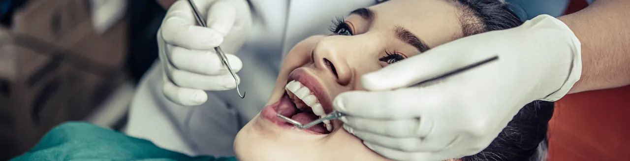 Dentist treating a patient's front teeth
