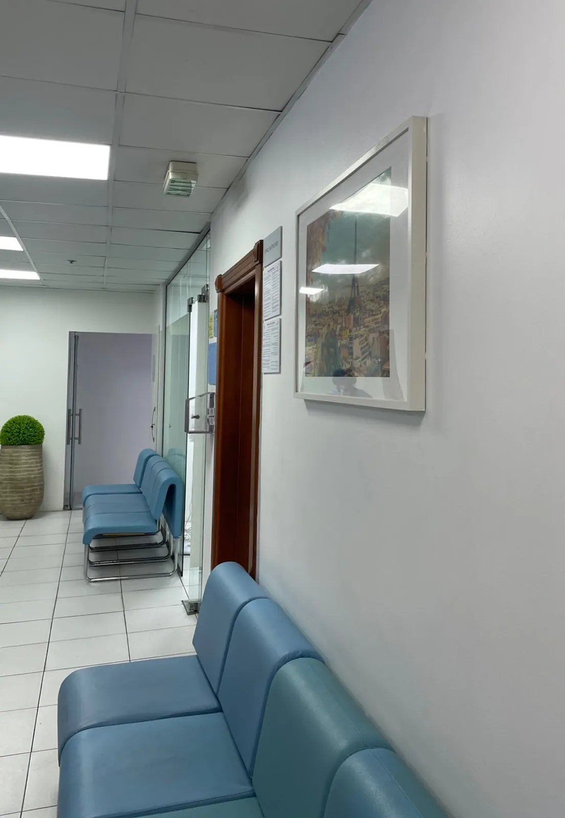 Corridor with blue chairs and a framed picture, Al Rigga (Deira)