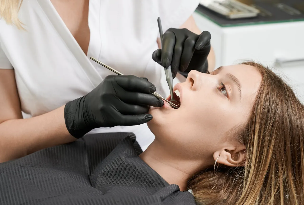 Dentist examining a patient before a tooth extraction